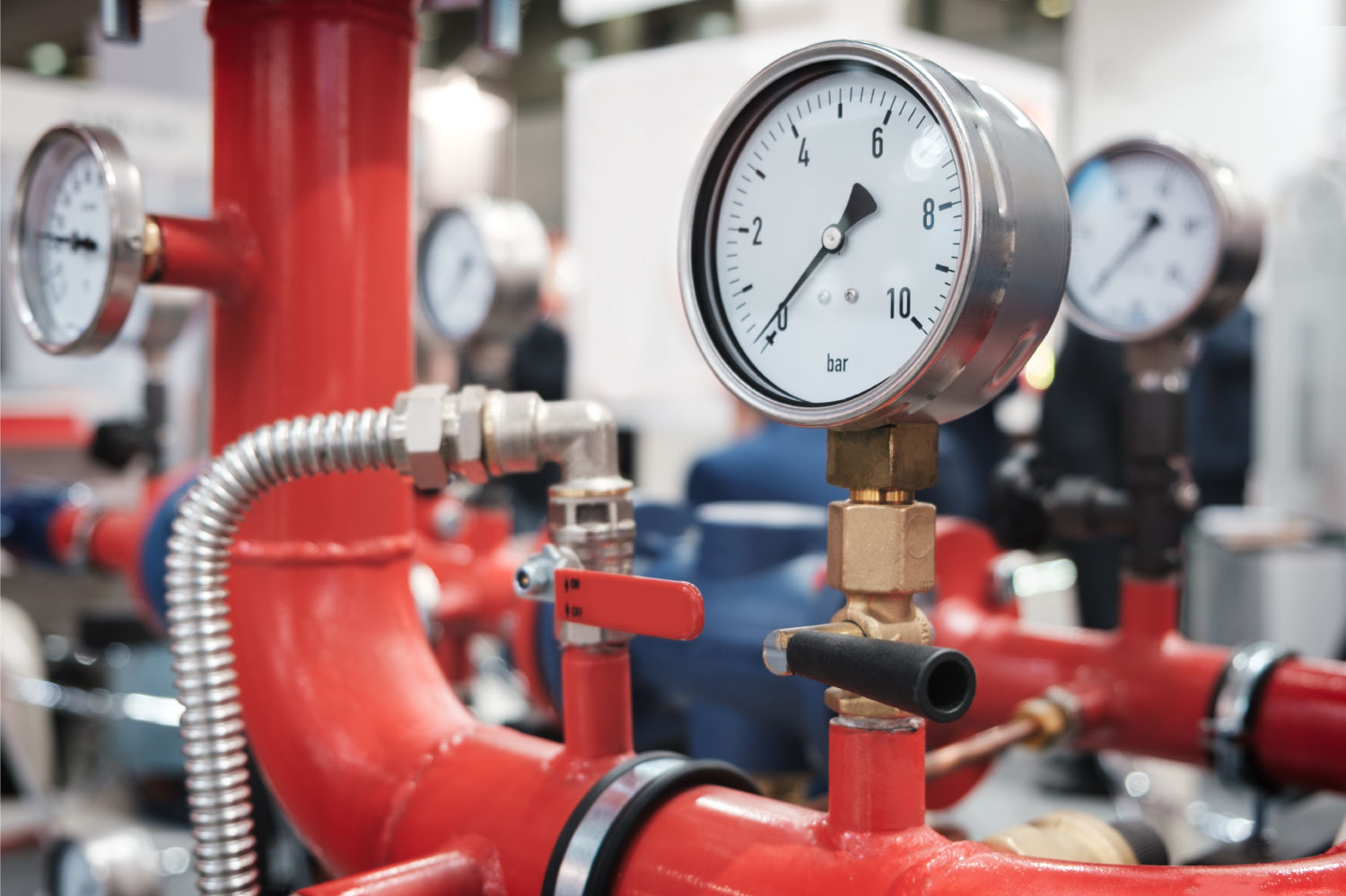 close up of the pumps and valves of a commercial heating system